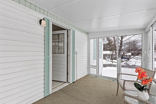 unfurnished sunroom featuring a wealth of natural light