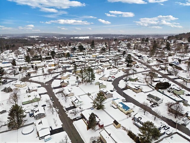 snowy aerial view featuring a residential view