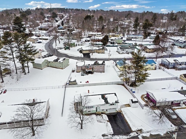 snowy aerial view featuring a residential view