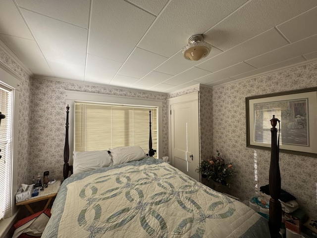 bedroom with wallpapered walls