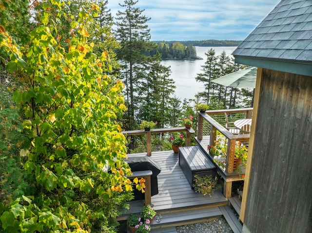 wooden terrace with a water view