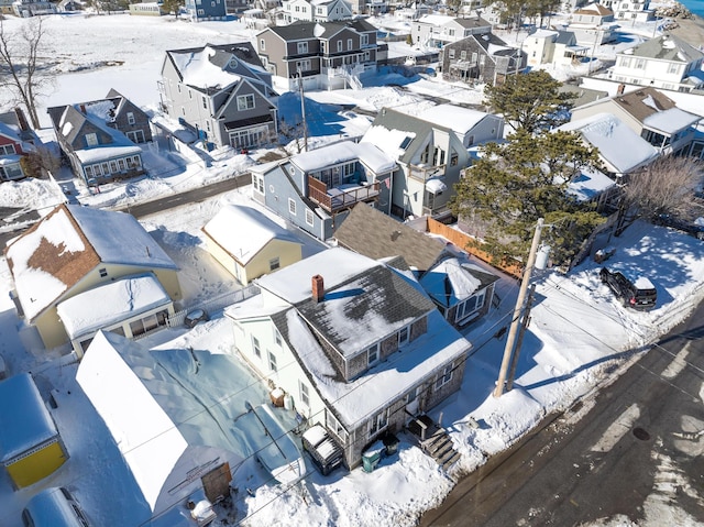 snowy aerial view with a residential view