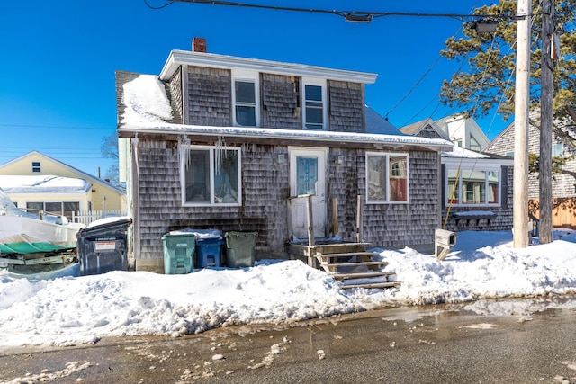 view of front of property featuring a chimney