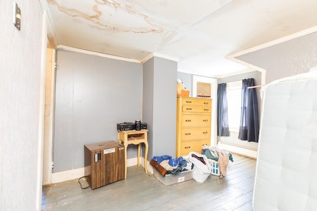 office space featuring crown molding and wood finished floors