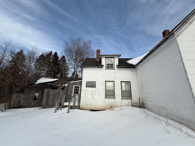 view of snow covered property