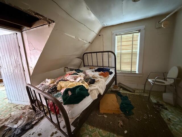 bedroom with lofted ceiling