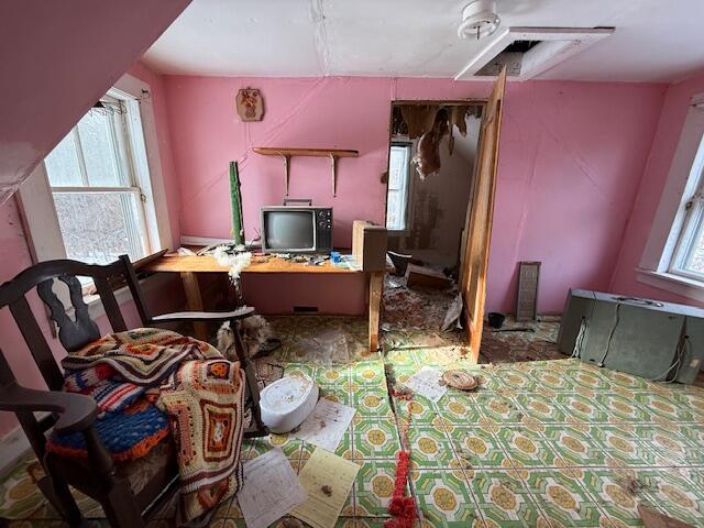 bedroom featuring multiple windows