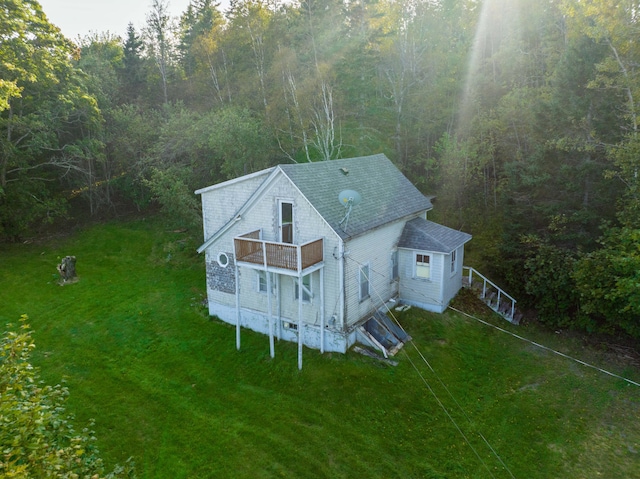 aerial view featuring a wooded view