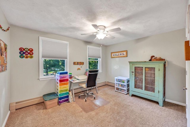 carpeted office space featuring a textured ceiling, a baseboard radiator, baseboards, and a healthy amount of sunlight