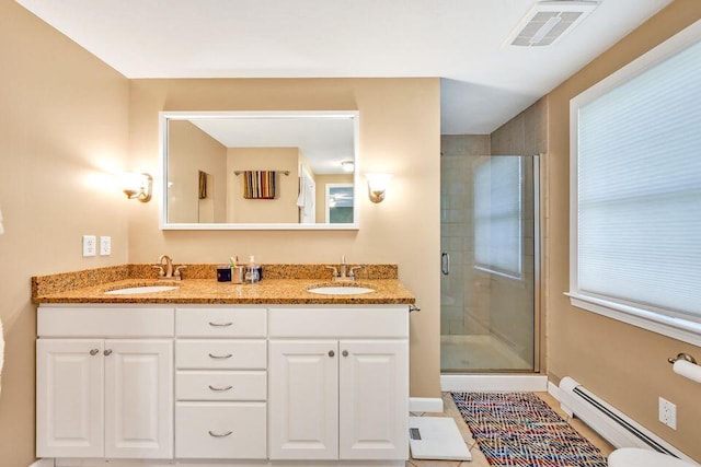 full bath with a stall shower, visible vents, a sink, and baseboard heating