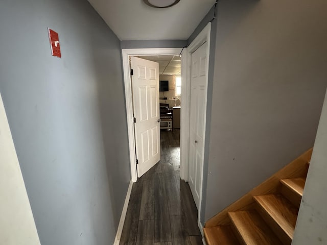 3 Jack St, Winslow, ME 04901 - corridor featuring baseboards, dark wood-style floors, and stairway