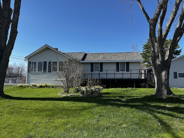 5 Pleasant View Ridge Rd, China, ME 04358 - ranch-style home with roof with shingles, a front yard, and a deck