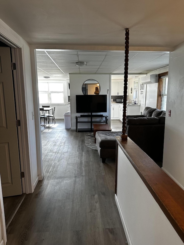5 Pleasant View Ridge Rd, China, ME 04358 - hall with baseboards, a drop ceiling, and dark wood-type flooring