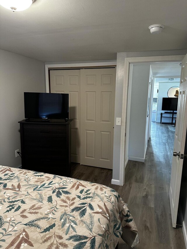 5 Pleasant View Ridge Rd, China, ME 04358 - bedroom with a closet, dark wood-type flooring, and baseboards