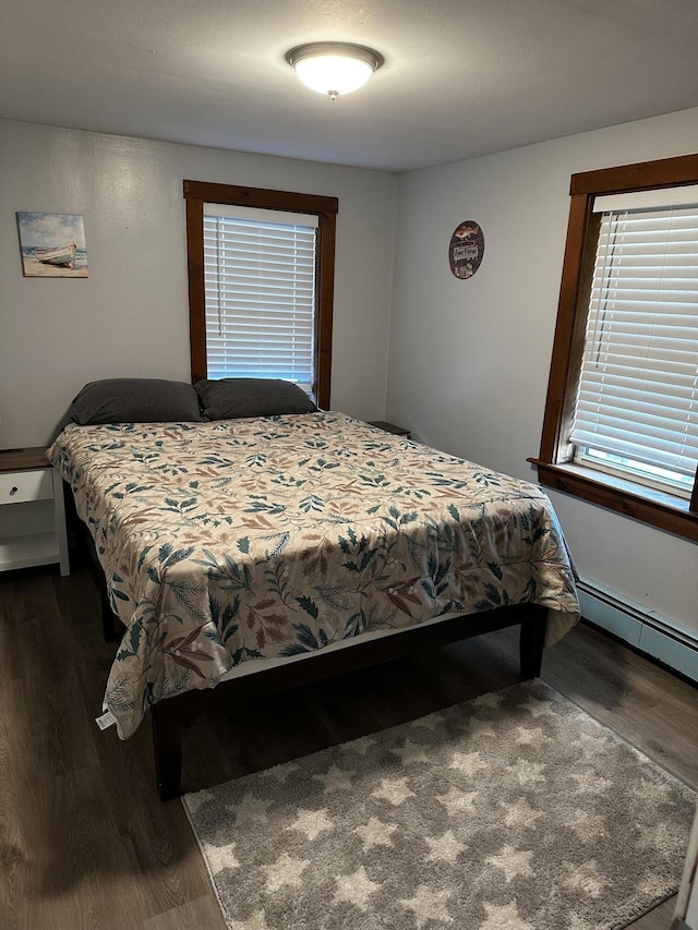 5 Pleasant View Ridge Rd, China, ME 04358 - bedroom featuring dark wood-style flooring, multiple windows, and a baseboard radiator