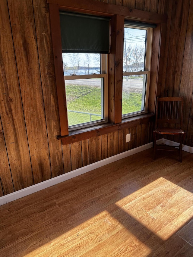 5 Pleasant View Ridge Rd, China, ME 04358 - spare room with baseboards, wood walls, and wood finished floors