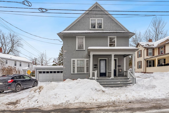 american foursquare style home featuring a porch