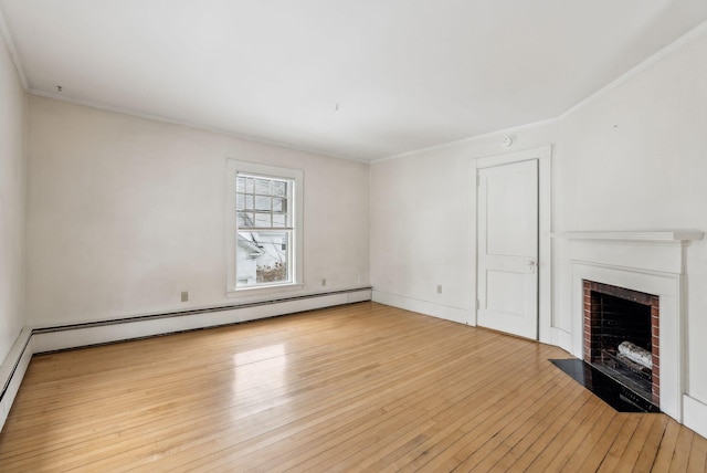 unfurnished living room featuring a baseboard heating unit, ornamental molding, a brick fireplace, and light wood-style flooring