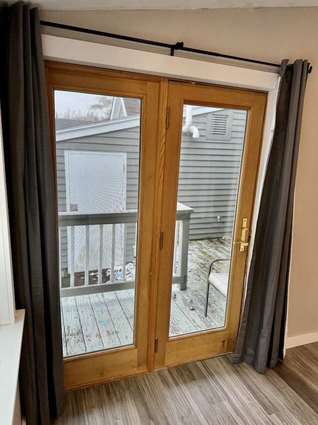 doorway featuring wood finished floors