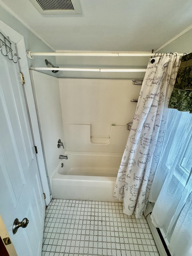 bathroom featuring visible vents and shower / bath combo with shower curtain