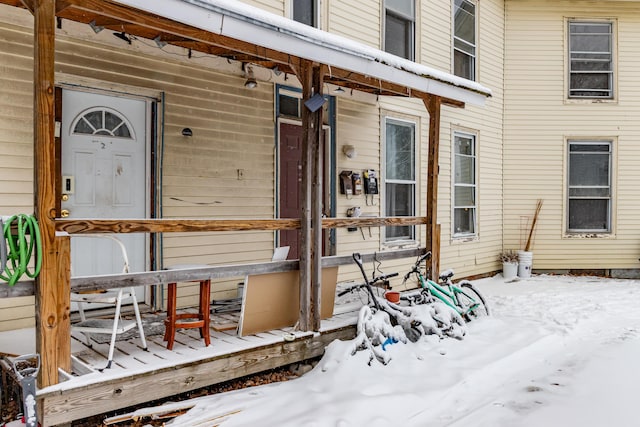 view of snow covered property entrance