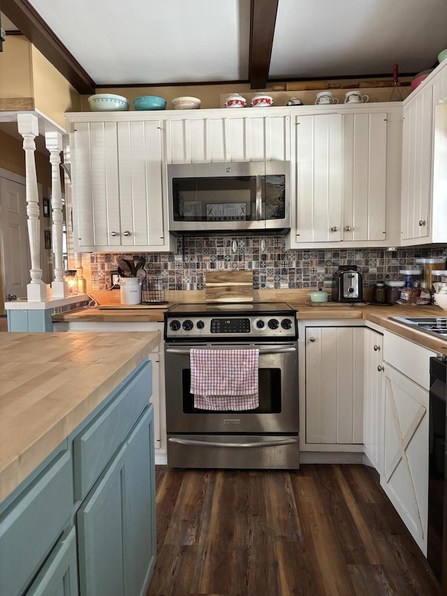 kitchen with decorative backsplash, appliances with stainless steel finishes, dark wood-type flooring, white cabinetry, and wood counters