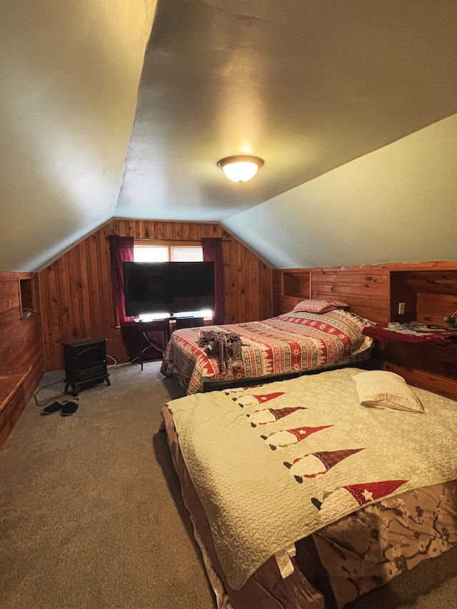 bedroom with carpet floors, lofted ceiling, and wood walls