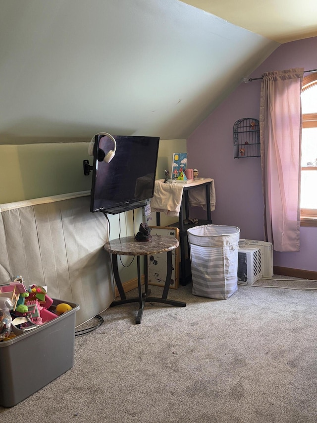 rec room featuring carpet and lofted ceiling