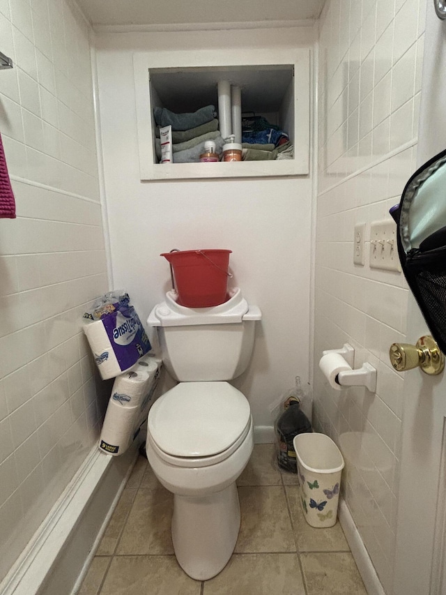 bathroom featuring toilet and tile patterned floors