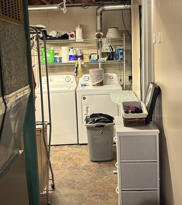 clothes washing area featuring laundry area and separate washer and dryer