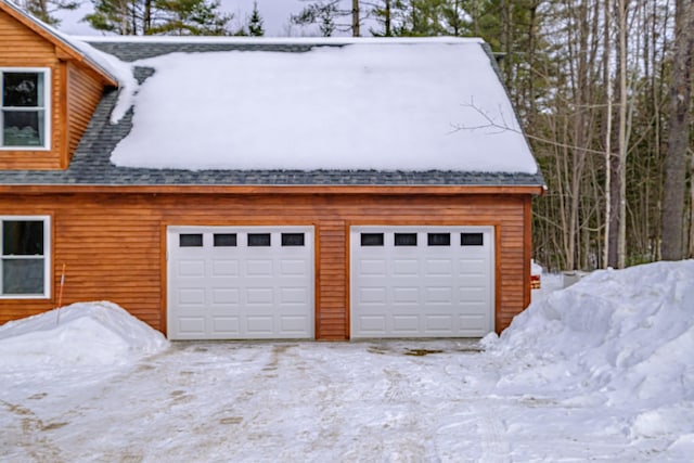 view of snow covered garage