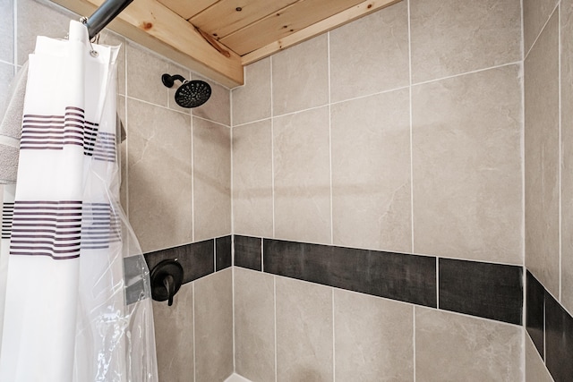 full bath featuring a tile shower