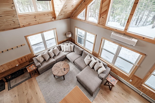 living room with a wall unit AC, wooden ceiling, a baseboard heating unit, a healthy amount of sunlight, and wood-type flooring