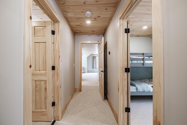 hall with light carpet, wood ceiling, baseboards, and recessed lighting