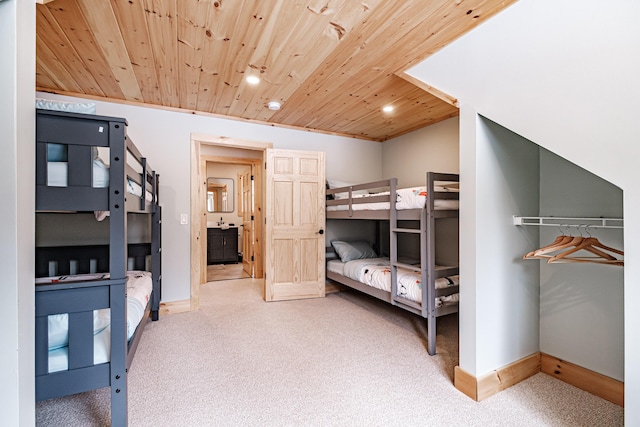 bedroom featuring recessed lighting, wood ceiling, carpet flooring, and baseboards