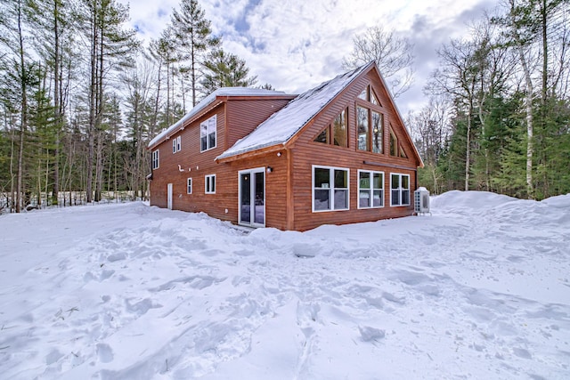 snow covered house with a garage