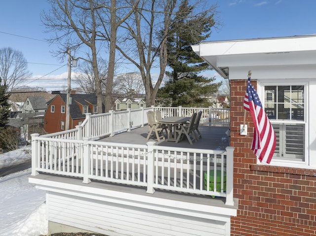 deck with outdoor dining area