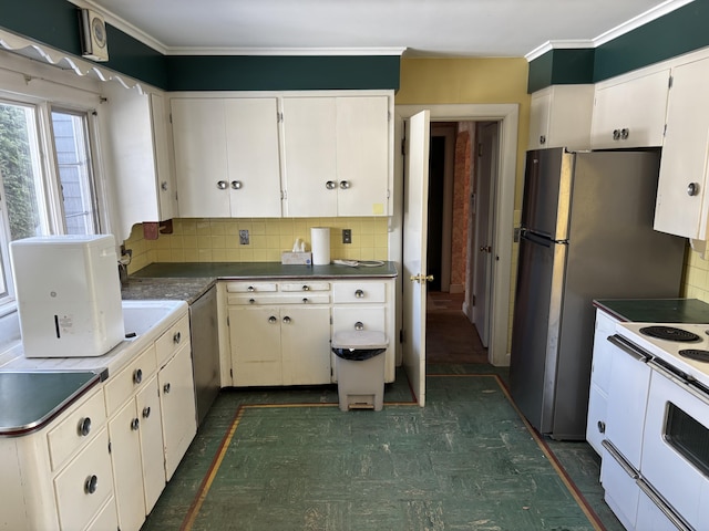 kitchen with tasteful backsplash, crown molding, white cabinetry, and white electric range