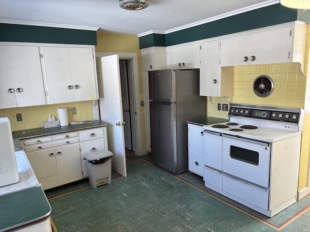 kitchen featuring tasteful backsplash, white cabinets, electric stove, and freestanding refrigerator