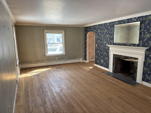 unfurnished living room with crown molding, a fireplace, a baseboard radiator, wood-type flooring, and wallpapered walls