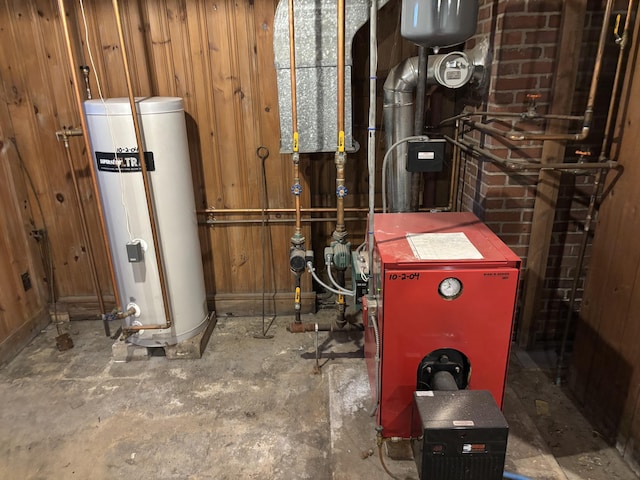 utility room with gas water heater and a heating unit