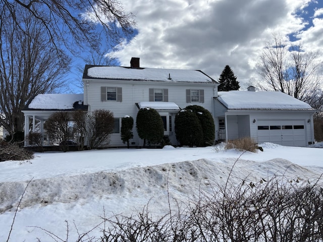 view of front of house with a garage and a chimney