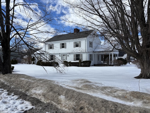 view of front of home featuring a chimney