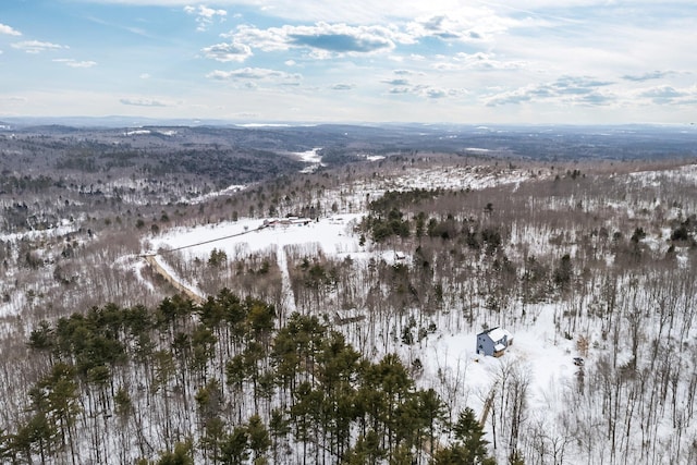 snowy aerial view with a mountain view