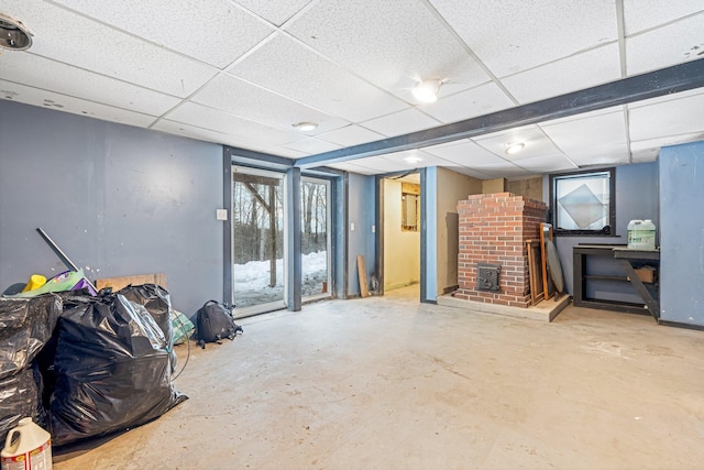 basement with a paneled ceiling