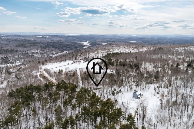 snowy aerial view featuring a mountain view