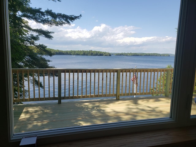 wooden deck with a water view