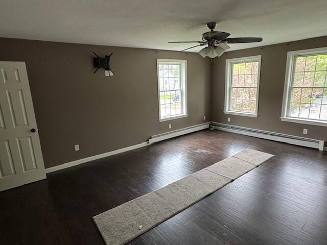 30 Hubbard St, Saco, ME 04072 - spare room with wood finished floors, baseboards, a ceiling fan, a baseboard radiator, and a baseboard heating unit