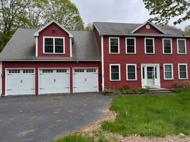 30 Hubbard St, Saco, ME 04072 - colonial-style house with asphalt driveway and a garage