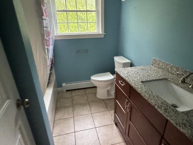 30 Hubbard St, Saco, ME 04072 - full bathroom featuring a baseboard radiator, vanity, toilet, tile patterned flooring, and baseboards